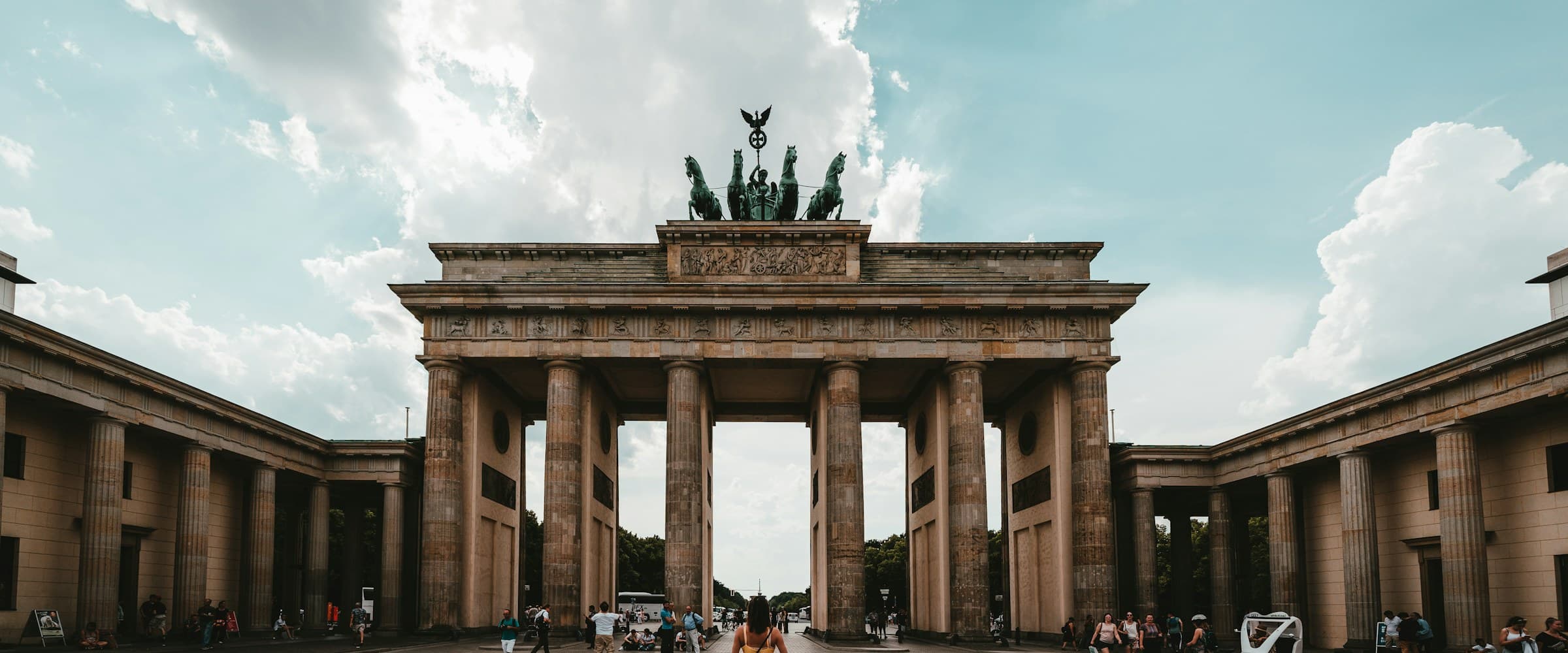 Wide view of Berlin landmarks under open sky